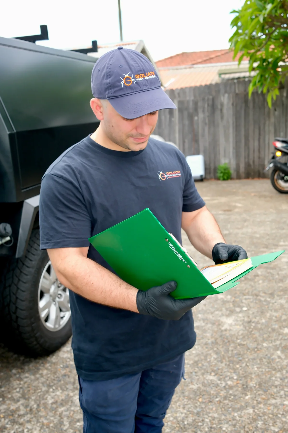 Goliath Pest Solutions reviewing paperwork on site
