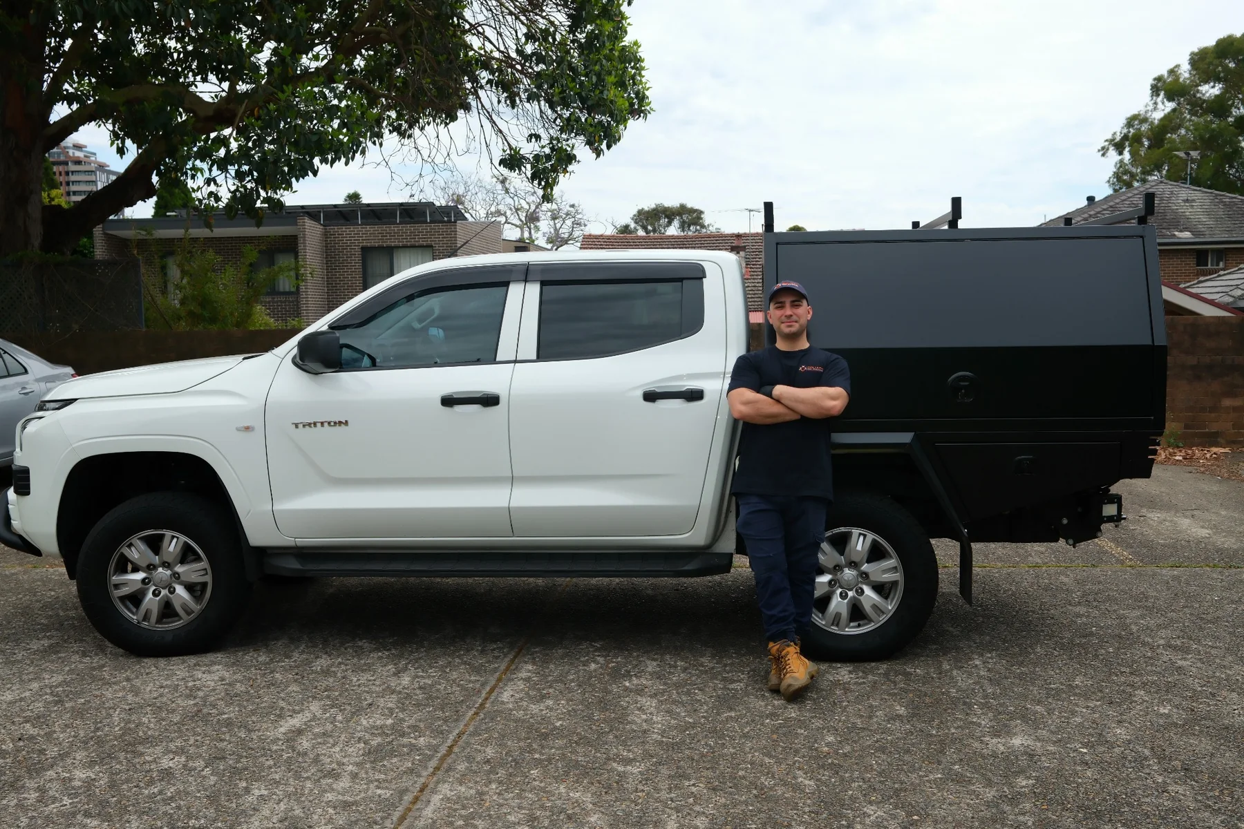Goliath Pest Solutions operator standing beside work vehicle