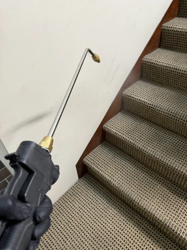Treatment lance directed toward an internal wall beside a staircase