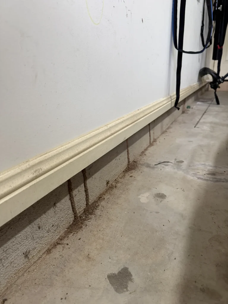 External wall base with soil and conduits requiring inspection access