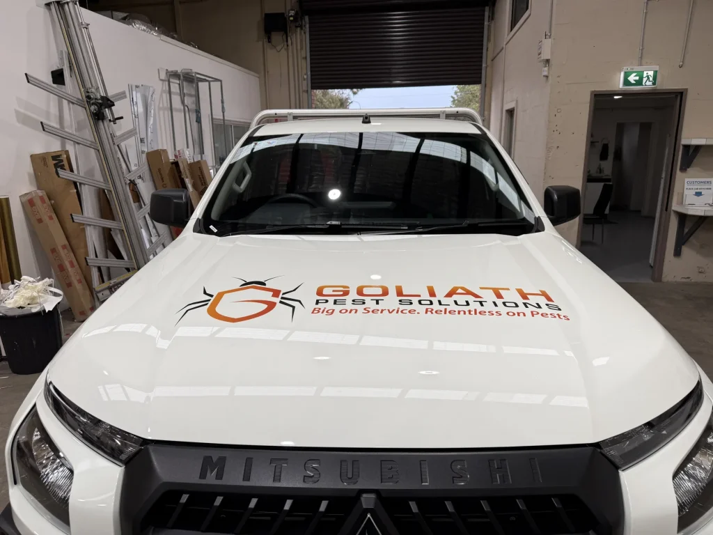 Front view of a Goliath Pest Solutions service vehicle