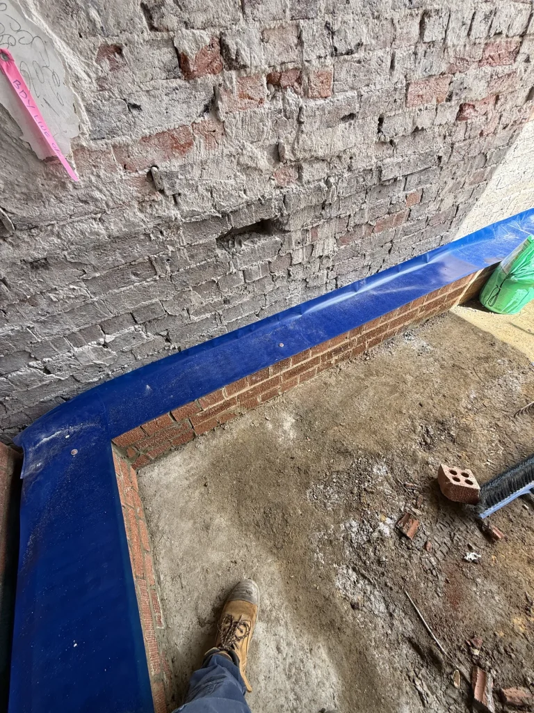 Termite barrier installation detail during building construction