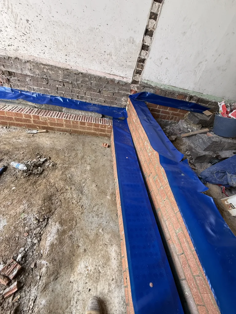 Physical termite barrier installed around a construction junction